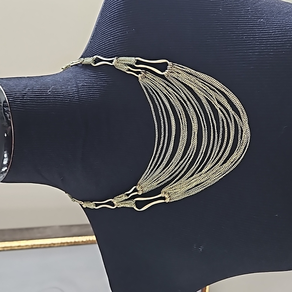 Layered metal necklace with extender